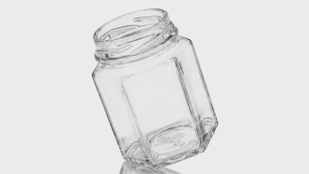 Load video: 9 oz (12 oz Honey) Clear Glass Hexagon Jar 63 mm Twist / Lug